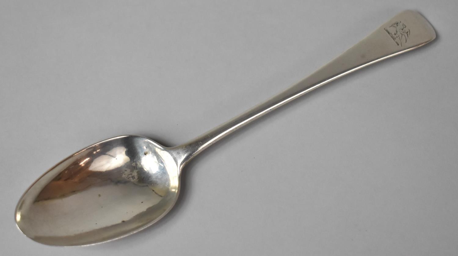 An 18th Century Georgian Silver Serving Spoon, Terminal with Griffin Heraldic Device Engraving,