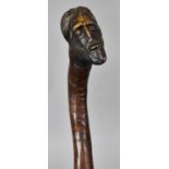 A 19th Century Folk Art Carved Walking Stick, the Handle Modelled as a Saracens Head, 102cm Long