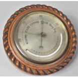 A 19th Century Aneroid Barometer with Silvered Dial and Curved Thermometer, Mounted in a Rope Carved