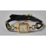 An 18ct Gold Ladies Vintage Mechanical Wrist Watch, Square face and with 17 Jewels, on Leather Strap