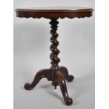 A Victorian Mahogany Tripod Table with Oval Top and Barley Twist Support. 60x44x70cms High
