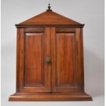 A Mahogany Cased Country House Style Shelved Cabinet of Architectural Form with Panelled Doors. 43.