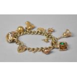 A Vintage 9ct Gold Bracelet having Eleven Charms, 34gms.