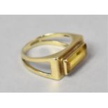 An Eastern 9ct Gold and Baguette Cut Yellow Moissanite Dress Ring. Rectangular Mount Leading to