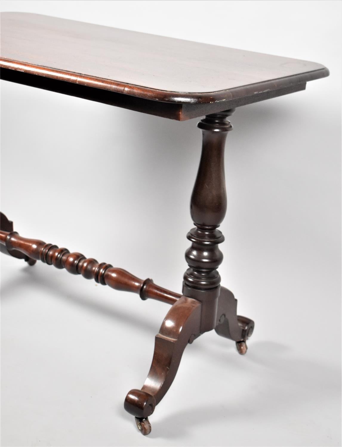 A Victorian Mahogany Rectangular Centre Table with turned Supports and Scrolled Feet. 107x66x79 - Image 2 of 2