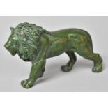 A Carved Green Stone Figure of a Prowling Lion, 16cm Long