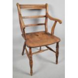 A 19th Century Elm Ladderback Kitchen Armchair on Turned Supports.