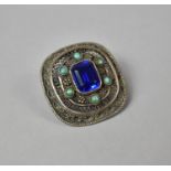 An Eastern White Metal Mounted Turquise and Blue Stone (Testing as Sapphire) Brooch (Missing