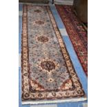 A Fine Hand Made Kashan Woollen Runner on Pale Blue Ground, 324 x 80cms