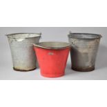 A Collection Three Galvanized Fire Buckets, One Painted Red