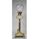 An Unusual Late Victorian Brass Oil Lamp having reeded Corinthian Column Support About to be Climbed