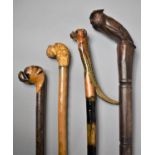 A Group of Four 20th Century Walking Sticks and Canes with Carved Animal Head Handles, The Longest