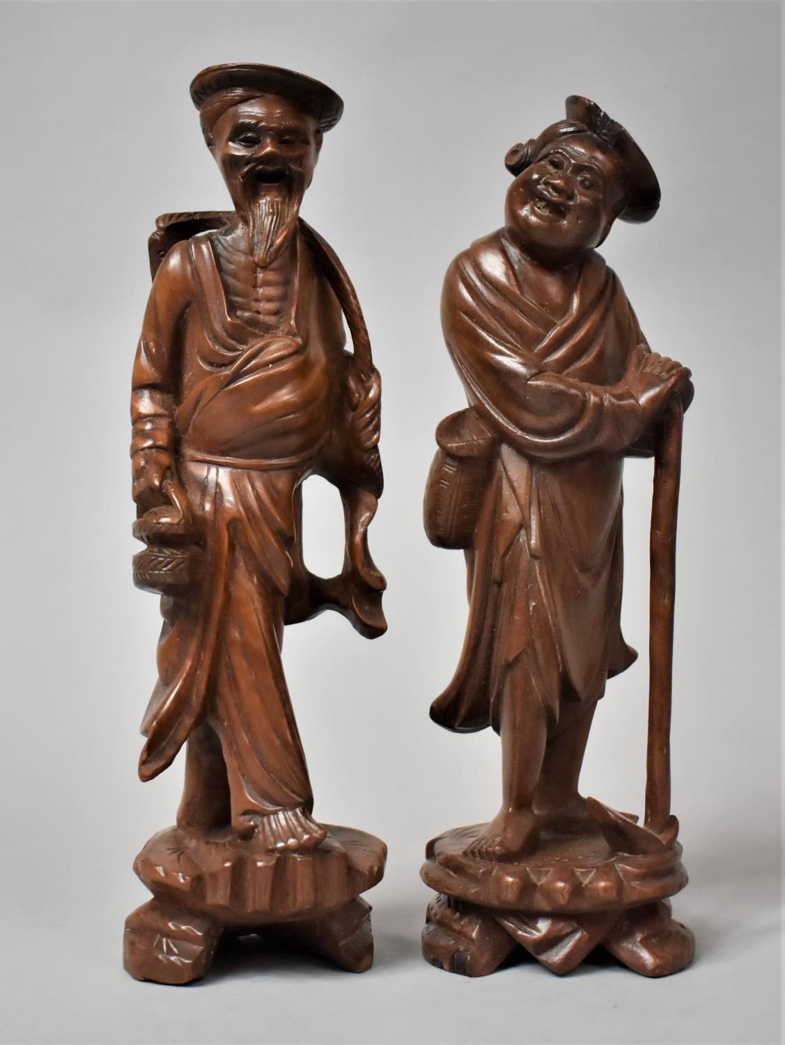 A Pair of 19th Century Chinese Carved Hardwood Figures of Immortals, 23cm high