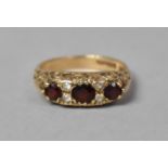 A 9ct Gold Ring Set with Garnets and White Stones, Birmingham Hallmark, 3.9gms, Size P