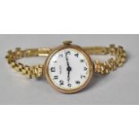 A 1930s 9ct Gold Rolex Wrist Watch, White Enamel Dial with Arabic Black Enamelled Numerals and
