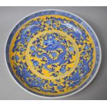 A Large Chinese Blue and White Charger Decorated with Central Five Claw Dragon Amongst Foliage and