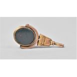 A Victorian Swivel Fob in an Unmarked Rose Gold Metal Mount Having carnelia and Bloodstones