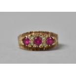 A 9ct Gold, Pink Ruby with White Sapphire Vintage Boat Style Ring. Each Ruby Approx .25ct. 3.9gms,