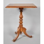 A Late Victorian Pitch Pine Tripod Table. 59x49x73cms