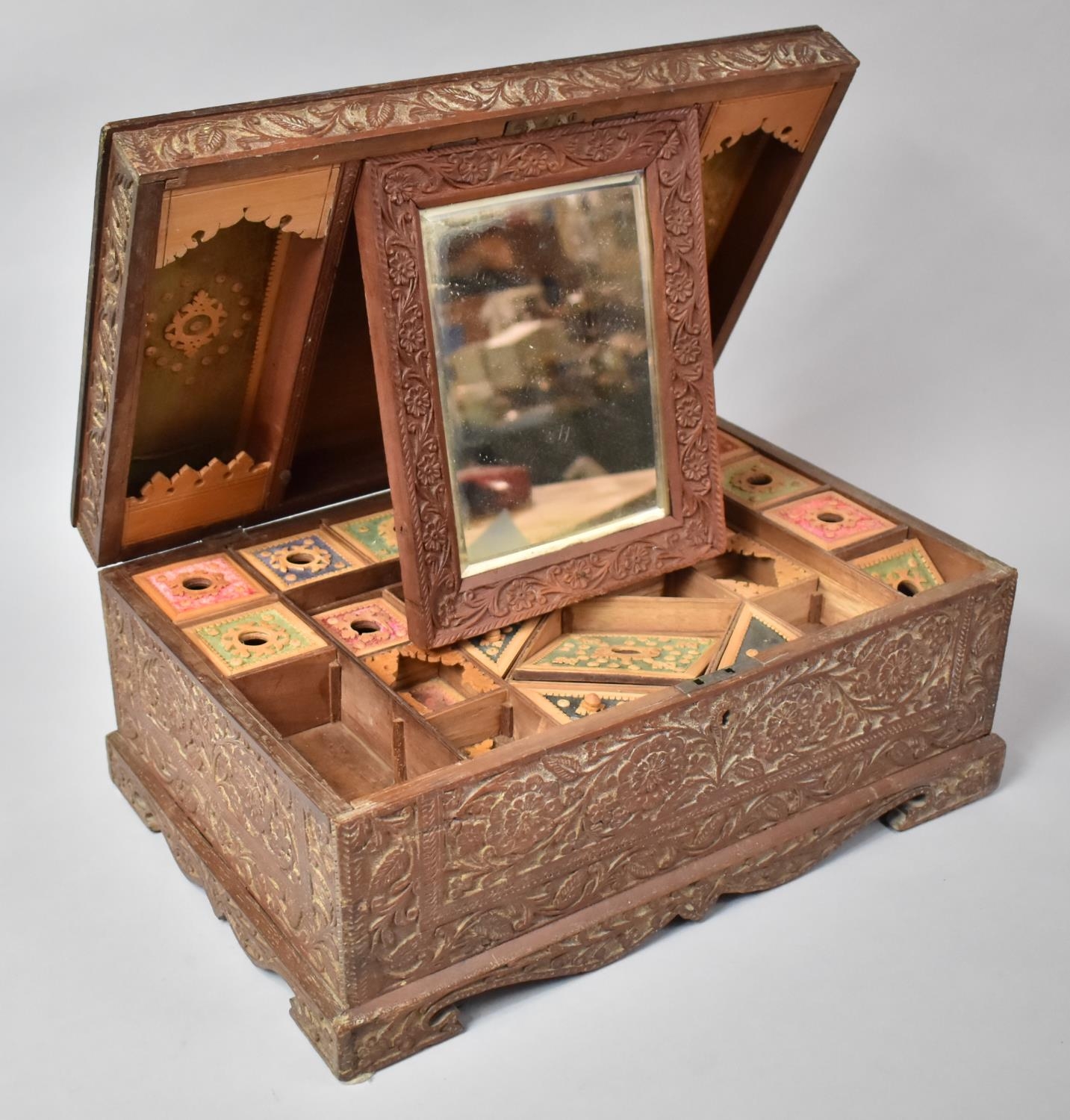 A Richly Carved Late 19th/early 20th Century Anglo Indian Colonial Travelling Box in Teak having