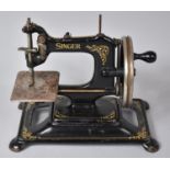 An Early Example of a Singer Sewing Machine by The Singer Manufacturing Co. on Shaped and Pierced