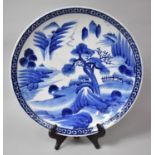 A Large Blue and White Japanese Charger, 20th century Exterior Village Scene, 46cms Diameter