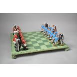 A Chess Set Depicting Red and Blue Football Teams, With Board as Pitch; Board 44cm Square, Tallest