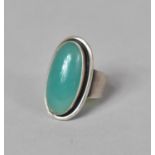 A Danish Sterling Silver Dress Ring by S C F with Green Polished Oval Stone in the Modernist Style