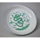 A Chinese Porcelain Shallow Bowl Having Central Five Claw Green Dragon Amongst Scrolled Sky