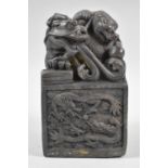 A Large Heavy Bronze Chinese Seal Decorated with Dragons Chasing Flaming Pearl, 13cm high