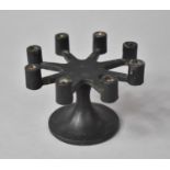 A Cast Metal Eight Branch Candle Holder, 10.5cm Diameter