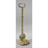 A 19th Century Brass Door Porter in the Form of a Lion's Paw, 38cm high