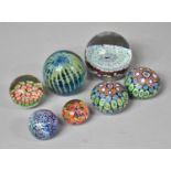 A Collection of Seven Glass Paperweights to Include Millefiori Examples