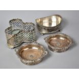 A Collection of Silver Plate to Include Pair of Bottle Coasters, Three Bottle Pierced Tantalus