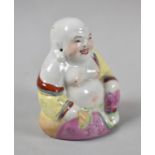 A Glazed Chinese Figure of Seated Smiling Buddha, 8cm high