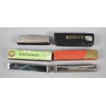 A Collection of Three Various Harmonicas to Include Hohner