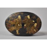 An Oval Lacquered Snuff Box, the Hinged Lid Decorated with Oriental Figures in Gilt and Ivory, 7.