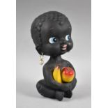 A Vintage Novelty Nodding Head Money Box in the Form of Seated Child Holding Fruit, 18cm high