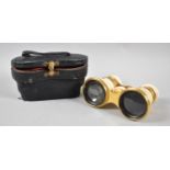 A Cased Pair of Late Victorian Gilt Brass and Ivory Opera Glasses, One Eye Piece Cracked