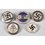 A Collection of Five Reproduction Enamel Nazi Swastika Badges