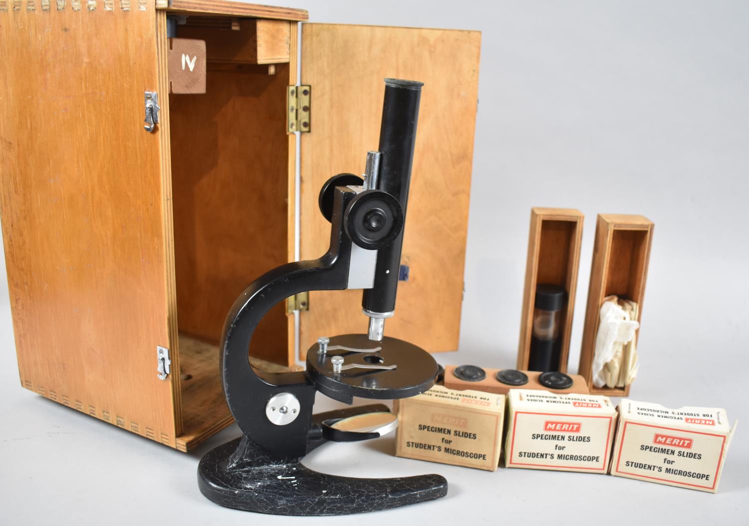 A Cased Students Microscope with Collection of Merit Specimen Slides, Spare Lenses etc