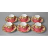 A Set of Six Royal Worcester Coffee Cans and Saucers Decorated with Gilt Swag on Pink Ground