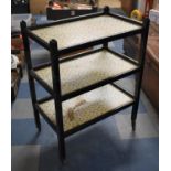A Mid 20th Century Black Painted Three Tier Trolley with Gallery Top, 66cm wide