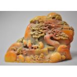 A Carved Composite Item, in the Form of Boulder with Village Scene Depicting Figures, Houses and