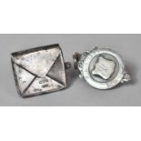 A Silver Fob Dated 1925 and a Silver Stamp Holder in the Form of an Envelope