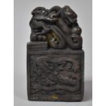A Large Heavy Bronzed Chinese Seal Decorated with Dragons Chasing Flaming Pearl, 13cm high