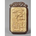 A Japanese Carved Wood and Bone Tablet Decorated in Relief with Exterior Scene, Inset Signed Disk to