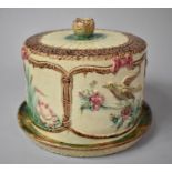 A Majolica Glazed Cheese Dish and Cover Decorated in Relief with Birds and Flowers, 21cm Diameter