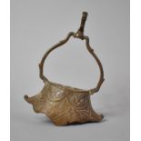 A Far Eastern Bronze Cast Bronze Stirrup with Foliate Motif Decoration, 18cm high