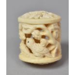 A Carved Bone Netsuke of Cylindrical form with Pierced and Carved Decoration Depicting Birds in